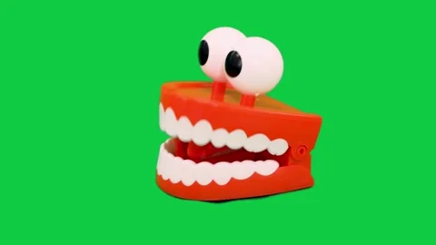 Left view of crazy chattering teeth against a greenscreen Stock Footage 141336895