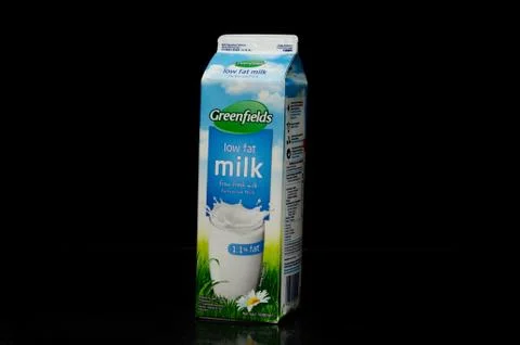 Left view of one liter of a low fat milk box from the Greenfields trademark o Stock Photos