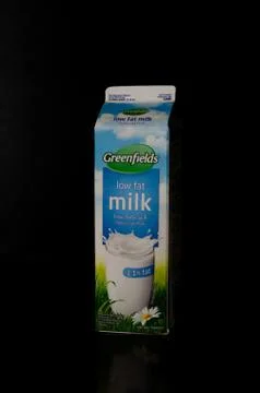 Left view of one liter of a low fat milk box from the Greenfields trademark o Stock Photos