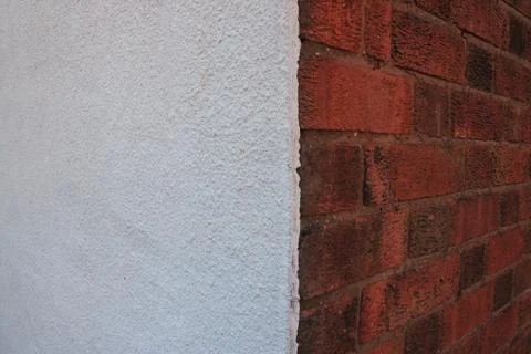 Left wall side white render right side brick and concrete Foto stock