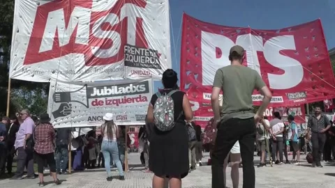 Left-wing groups and retirees protest against Milei, recalling the 2001 crisis,  Video stock 296024188