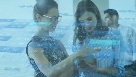 Left woman gesturing while right woman tapping tablet, animated charts guiding Stock Footage 335282537