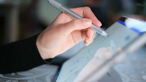 Left woman had while using graphics tablet stylus for home smart working,tech Stock Footage 150666691
