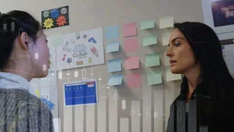 Left woman pointing CLOUD printout, sparking team sorting notes for business Stock Footage 332625462