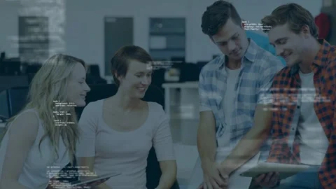 Left woman pointing tablet screen, causing code overlays drifting as tech team Stock Footage 334744158