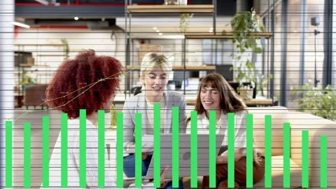 Left woman using laptop, turning screen; team reading docs, tablet, green bars Stock Footage 333602257