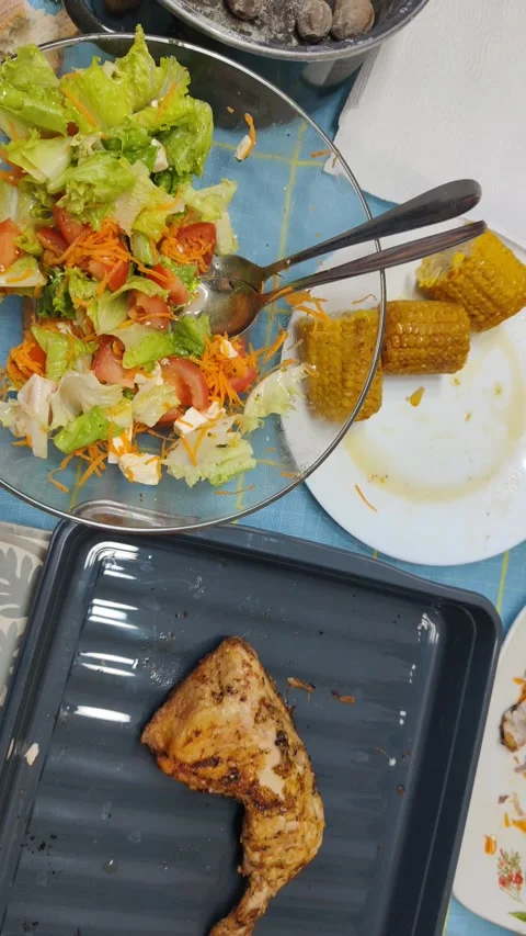 Leftover chicken and salad after a family dinner Stock Footage 341512680