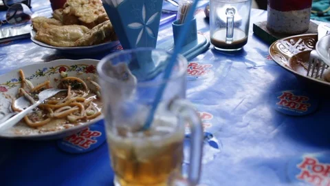 Leftover food and drinks after lunch in Indonesia Stock Footage 107635452