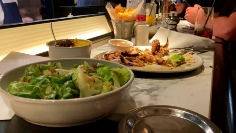 Leftover Food Sits On Table At An Upscale Restaurant Stock Footage 219694655