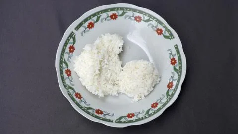 Leftover rice dish on gray background           Stock Photos