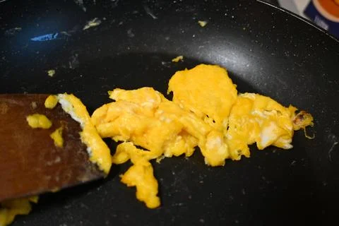 Leftover scrambled eggs in a pan 스톡 사진