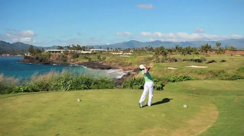 Lefty golfer hit is par 3 shot on hawaiian golf course Stock-Footage 48270635