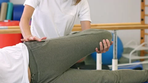 Leg and hip stretching physio treatment Stock Footage 161650679