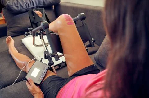 Leg on continuous passive machine, after surgery Stock Photos