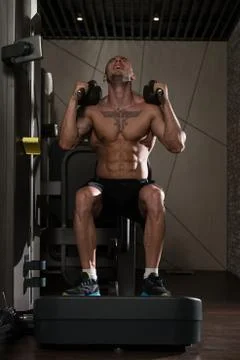 Leg Exercise On Machine Stock Photos