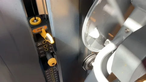 Leg extension, curl machine moving weights in action Stock Footage 143991441