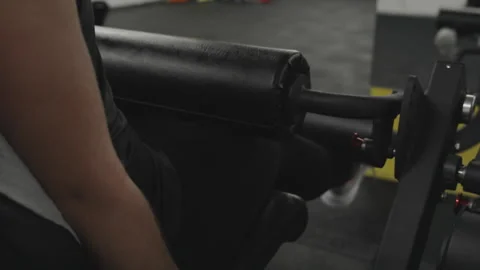 Leg extension on a machine is an isolating exercise for the quadriceps, promotin Stock Footage 255298721