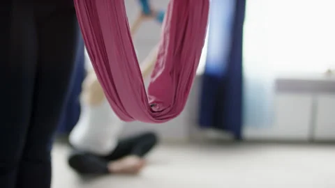 Leg in hammock during yoga class close view Stock Footage 133659143