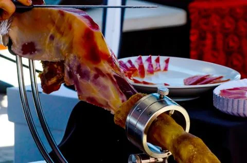 Leg jamon serrano prepared for slicing, traditional Spanish ham Stock Photos