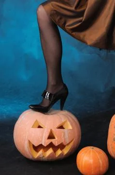 Leg on pumpkin Stock Photos