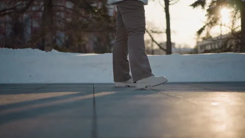 Leg View Dancer Moving on Tiled Pavement at Sunset Stock Footage 307457659