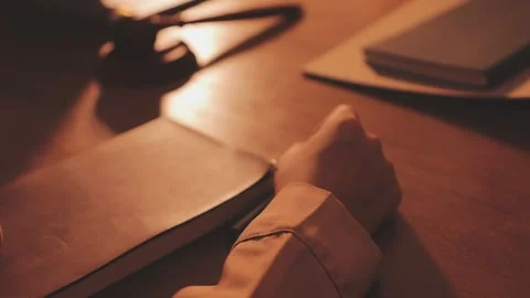Legal advisor is explaining the offense under the law in the book at office. Stock Footage 344458777