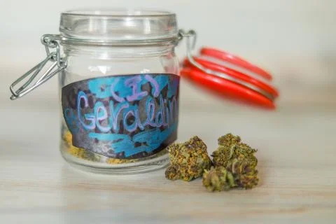 Legal Colorado marijuana next to a mason jar Stock Photos