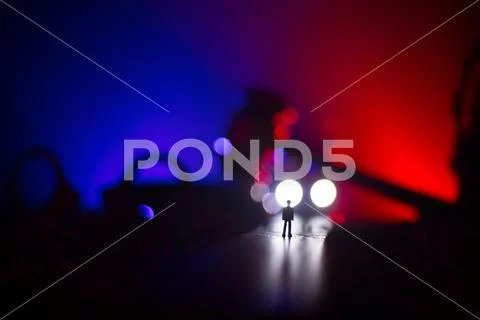 Legal law concept. Silhouette of handcuffs with The Statue of Justice on back Stock Photos