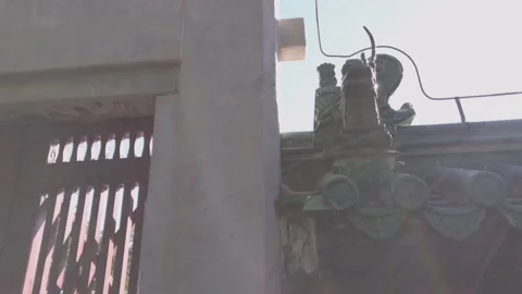 Legendary beast on eave of wall around altar of Sun in Ritan Park,Beijing,China Stock Footage 141554731