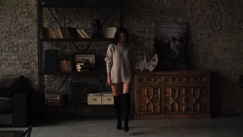 Leggy model posing in the studio, defeling on camera. Stock Footage 107320532