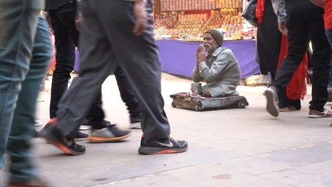 Legless beggar old man begging money from passers-by on street. Pushkar, India Stock Footage 100229956