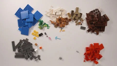 Lego bricks mix and sort on a white table (stop motion) Video stock 75020926