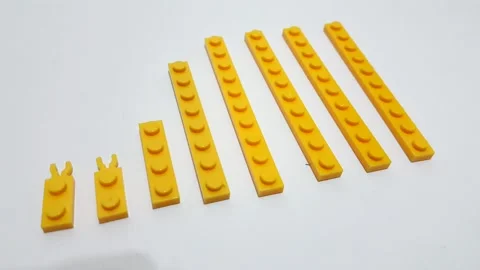 Lego pieces ordered from small to large Stock Footage 144929338