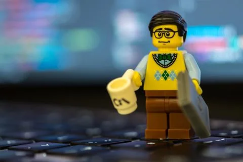 Lego programmer or teacher on keyboard Stock Photos