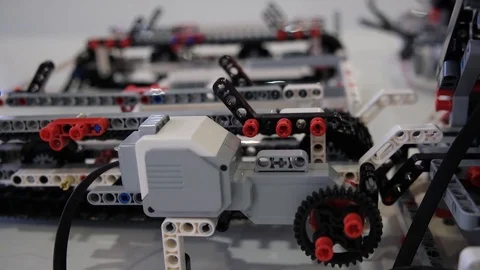 Lego robot with chain failed to put item on track with crane in first attempt. S Stock Footage 113138009