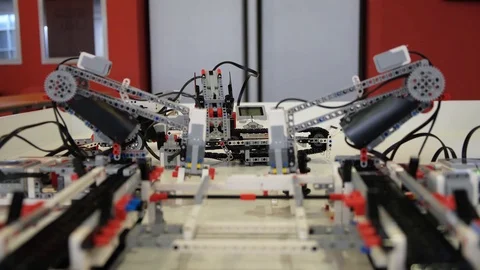 Lego robot put item on track with crane Stock Footage 113137992