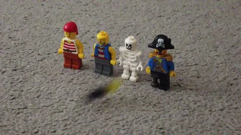 Lego skeleton shot by projectile slow motion Video stock 159949498