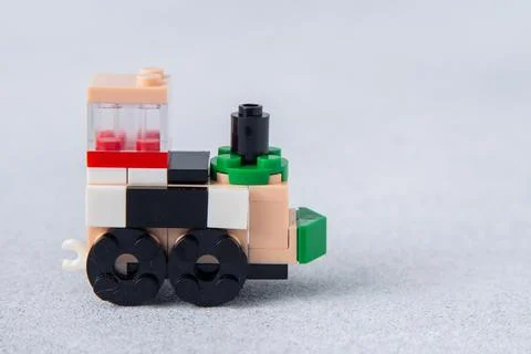 Lego train constructor from mini bricks and details. Children's craft. Game toy Stock Photos
