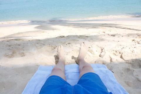 Legs on beach Stock Photos