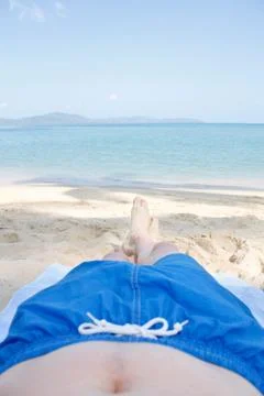 Legs on beach Stock Photos
