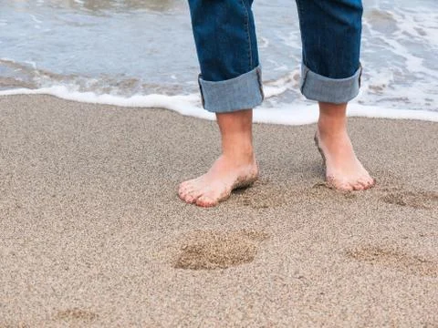 Legs on beach Stock Photos