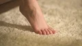 The legs on the beige carpet 4k or 4k+ Resolution