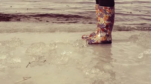 Legs in bright rubber boots Stock-Footage 60580551