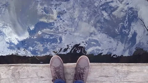 Legs in brown moccasins on background mountain river. Stock Footage 239021994