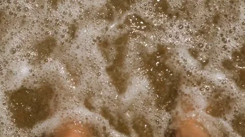 Legs on the brown in the sea Stock Footage