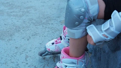 Legs of a child in roller skates. Stock Footage 78016628