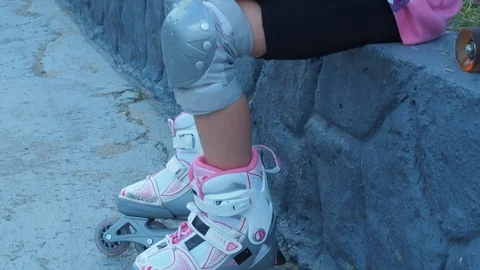 The legs of the child in the rollers. Stock Footage 78075812