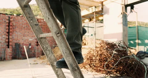 Legs, construction worker and walking on ladder for building development Stock Footage 336213215