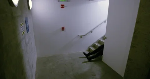 Legs Of A Corpse In A Stairwell Stock Footage