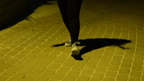 Legs dancing in evening park. Close-up. 스톡 동영상 94425763